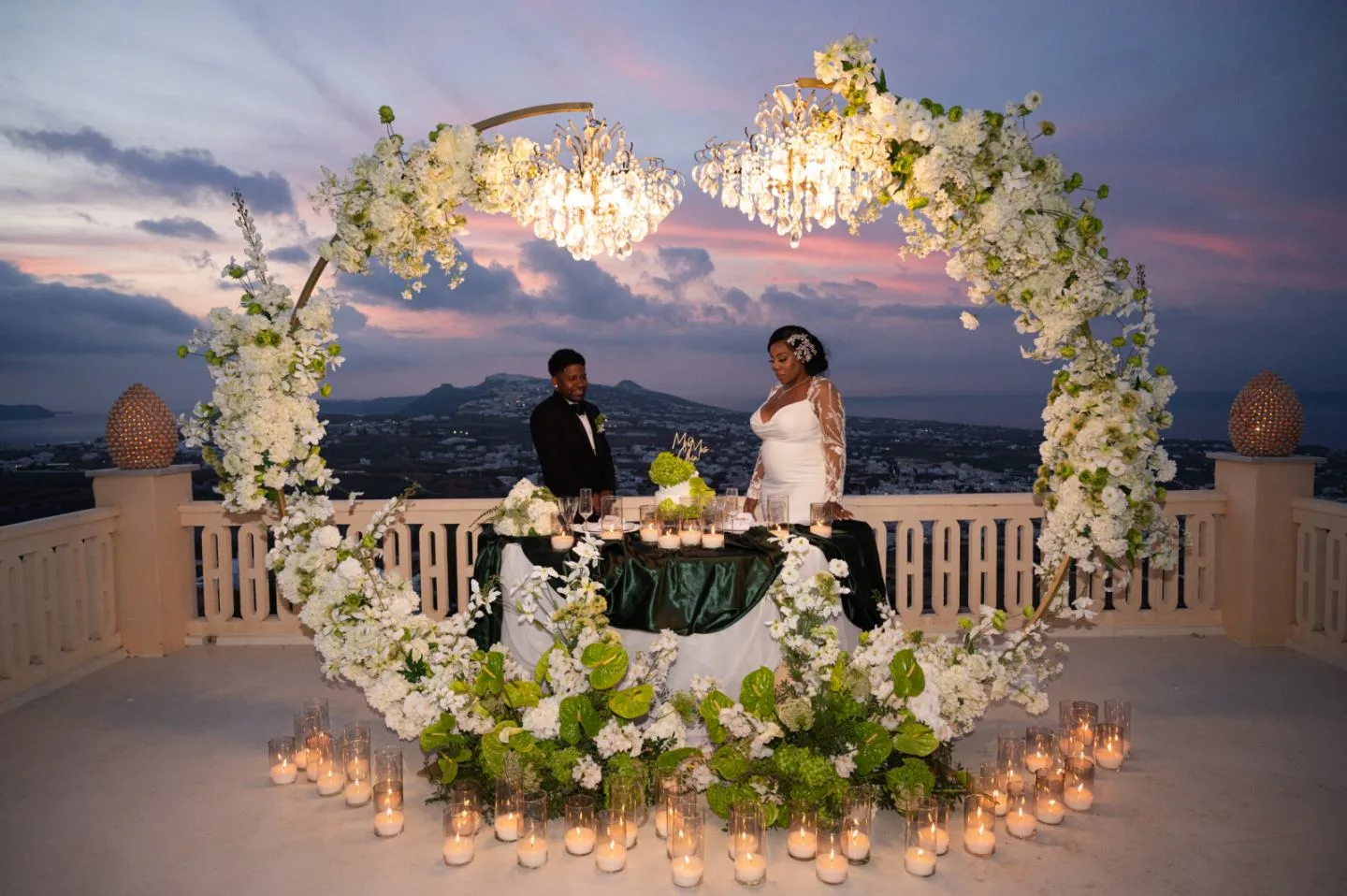 A reception table styled with crystal chandeliers in Santorini