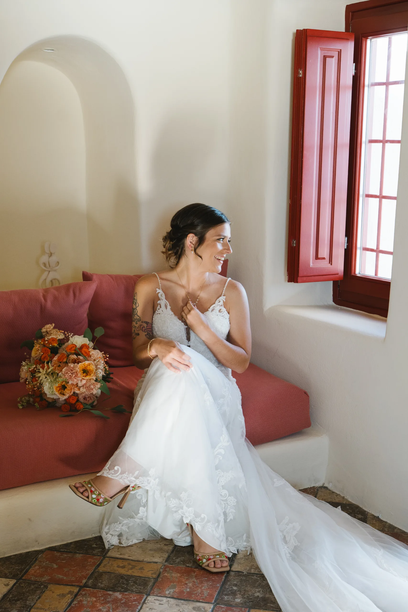 Bride with an autumn bouquet in a Santorini villa, planned by The Diamond Rock
