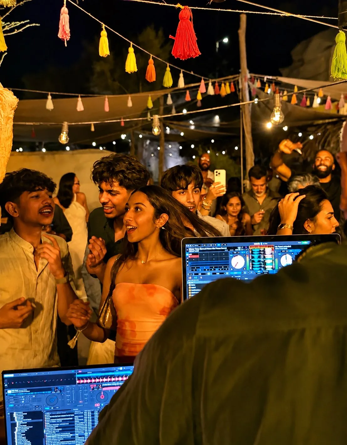 Dancing under the party lights at a Santorini wedding
