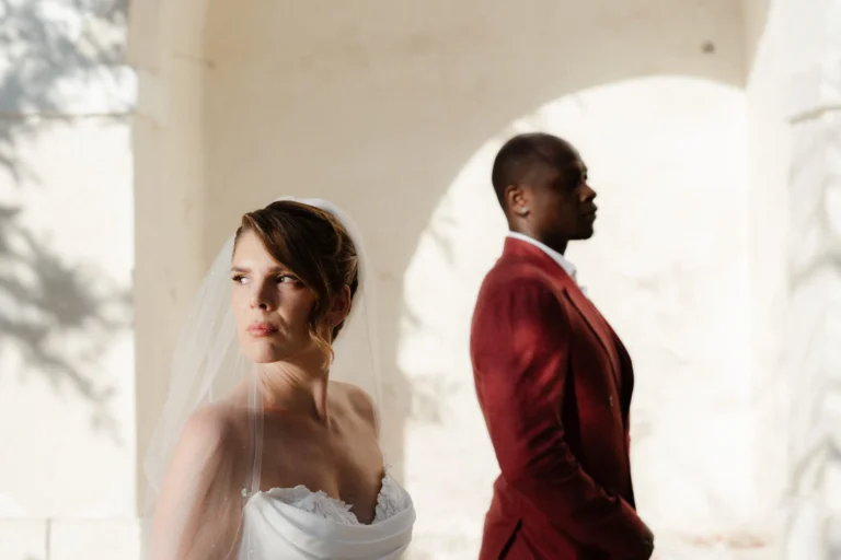 Kerry & Ayden wedding at Santorini Gem — bride and groom in a whitewashed archway