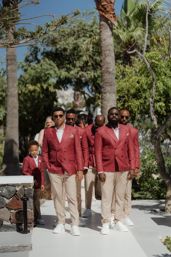 Kerry & Ayden wedding at Santorini Gem — the groom and groomsmen in burgundy jackets