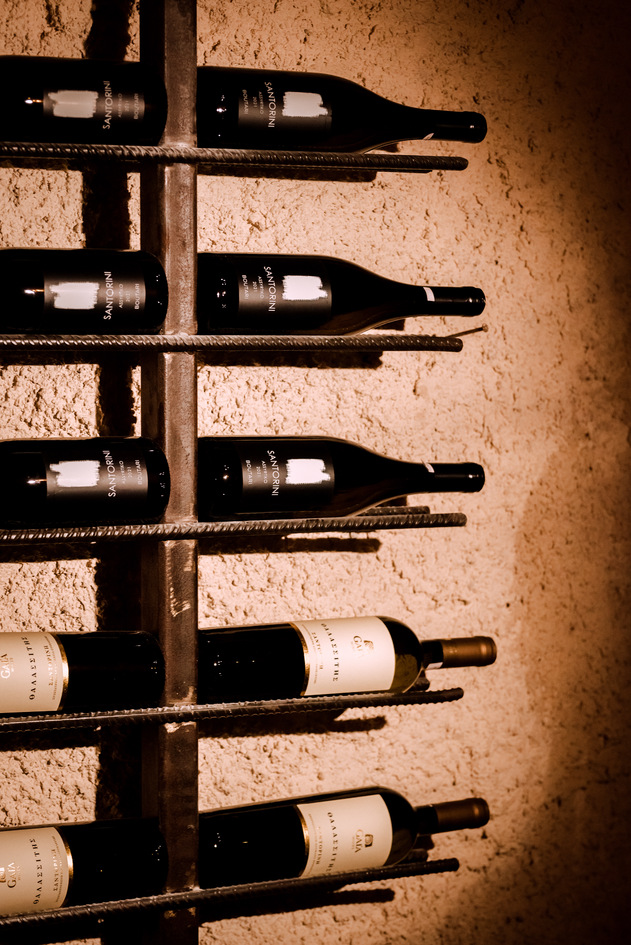 Santorini wine bottles in the racks at Madame Sousou