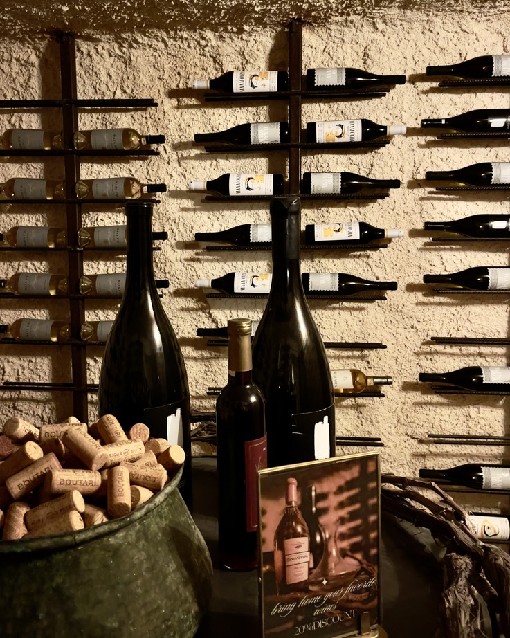 Bottles and corks at a Santorini wine tasting