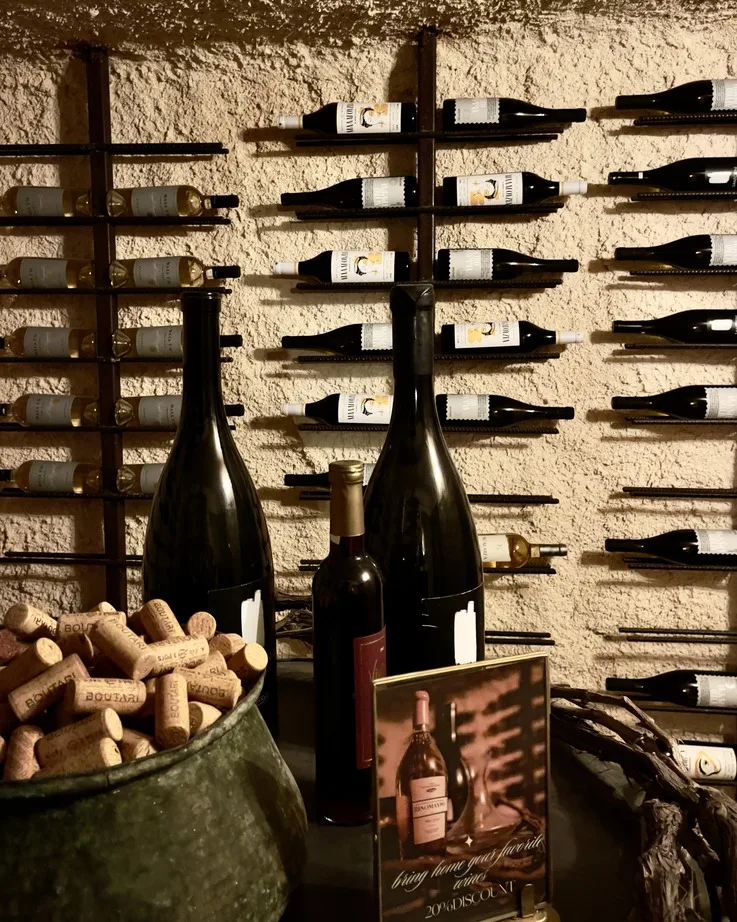 Bottles and corks at a Santorini wine tasting