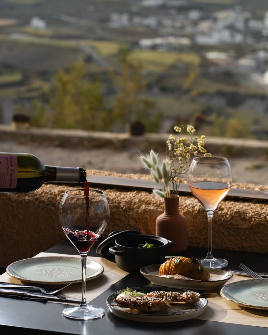 Wine glasses above the caldera in Santorini