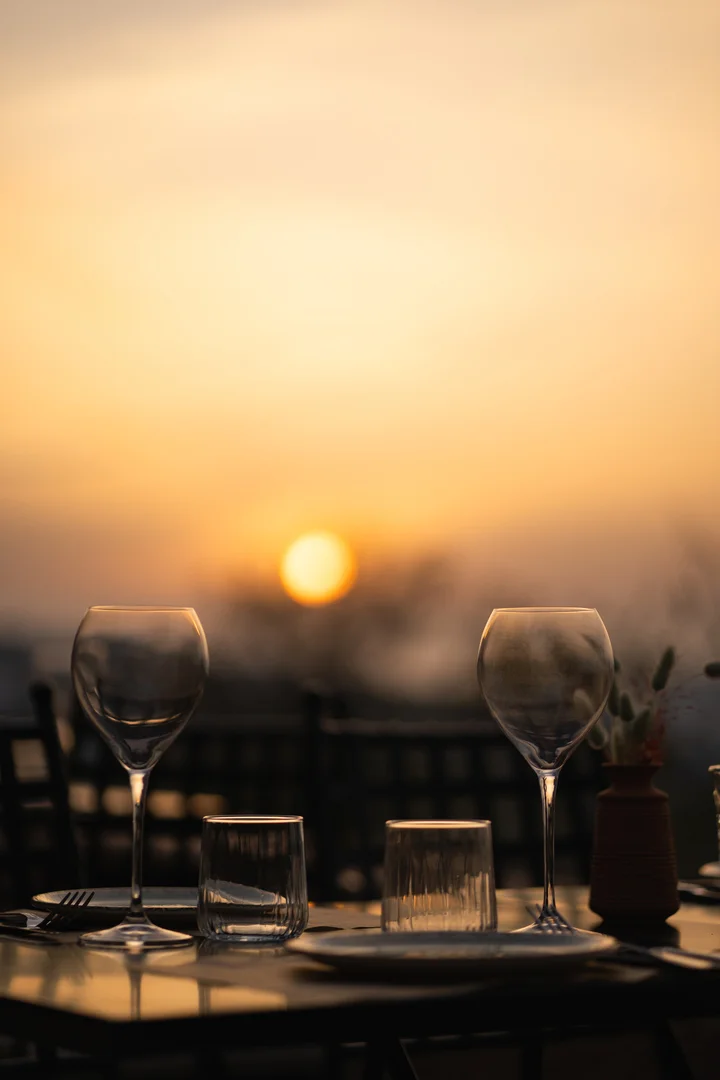 Two glasses of wine at sunset in Santorini