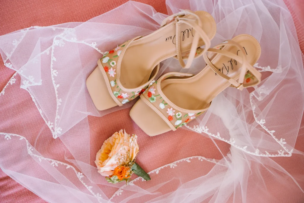 Andrea & Jordan wedding at Love Cave Venue, Santorini — the bride’s floral-embroidered heels