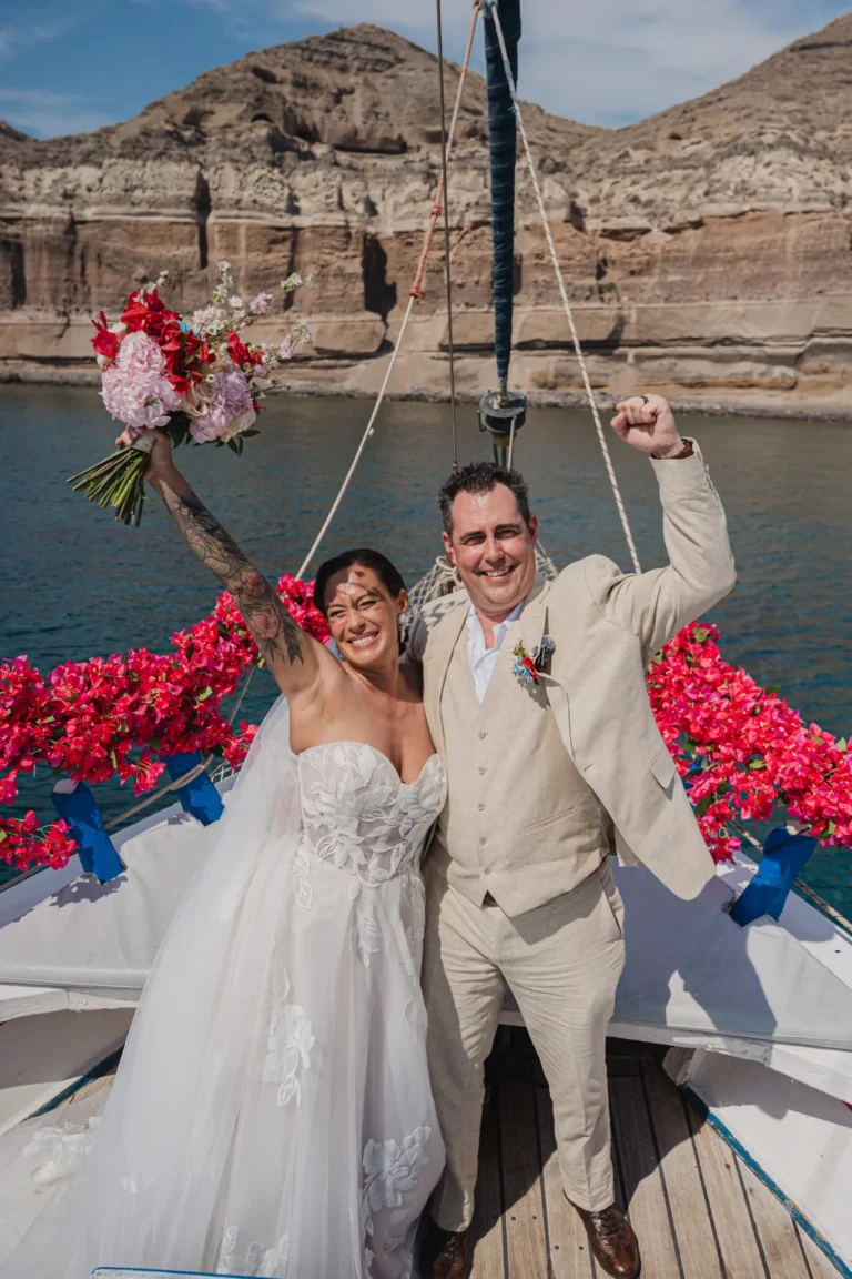 Angela & David wedding aboard a traditional Greek boat, Santorini — celebrating as husband and wife on deck