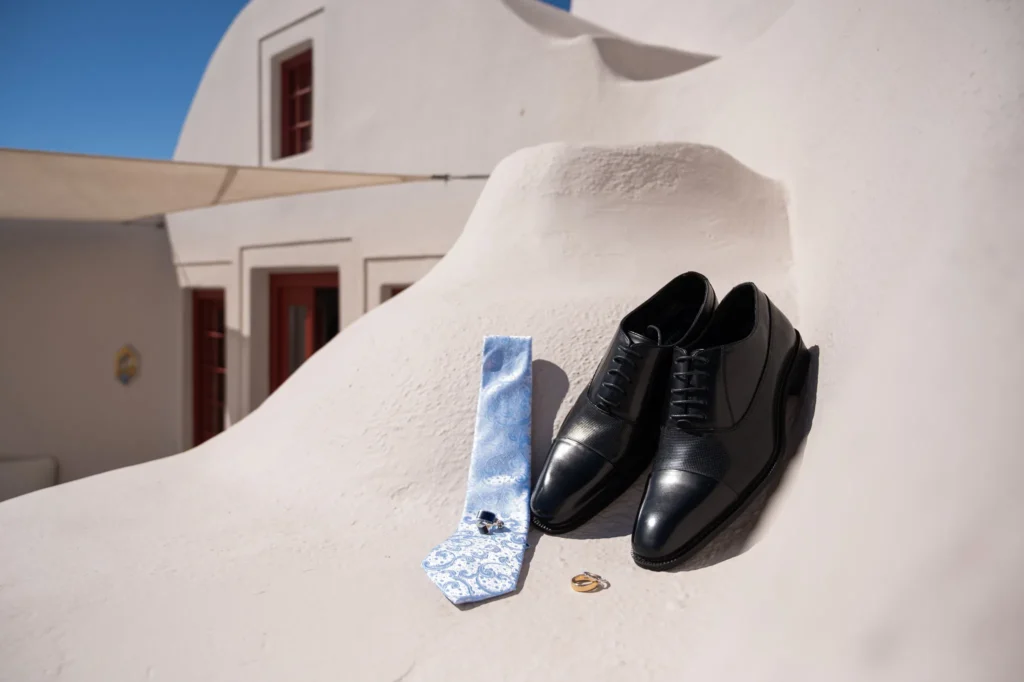 Crystal & Gabriel wedding at Love Cave Venue, Santorini — the groom’s shoes, tie and rings