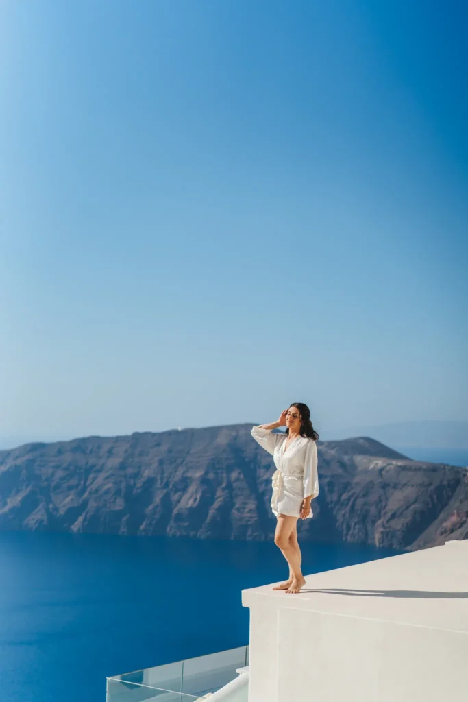 Elisa & Diego wedding at Astra Chapel & 5 Senses Restaurant, Santorini — the bride on the terrace above the caldera