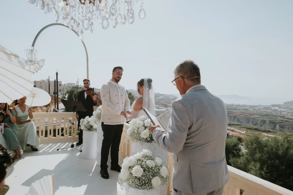 Hazel & Soltan wedding at Madame Sousou, Santorini — the ceremony on the terrace