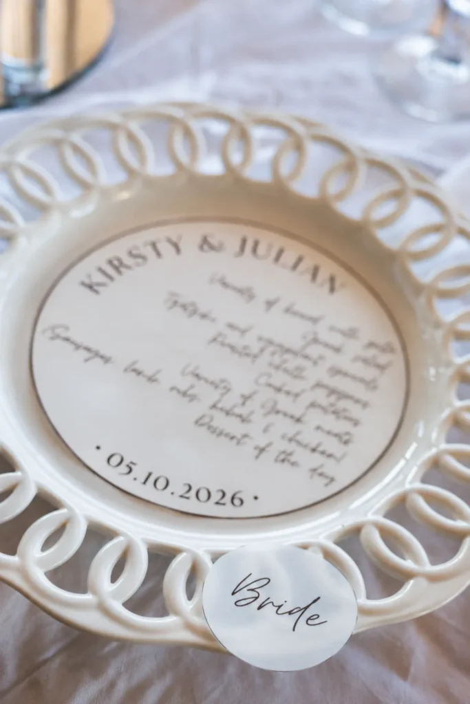 Kirsty & Julian wedding at Madame Sousou, Santorini — the place setting engraved with their names and the date
